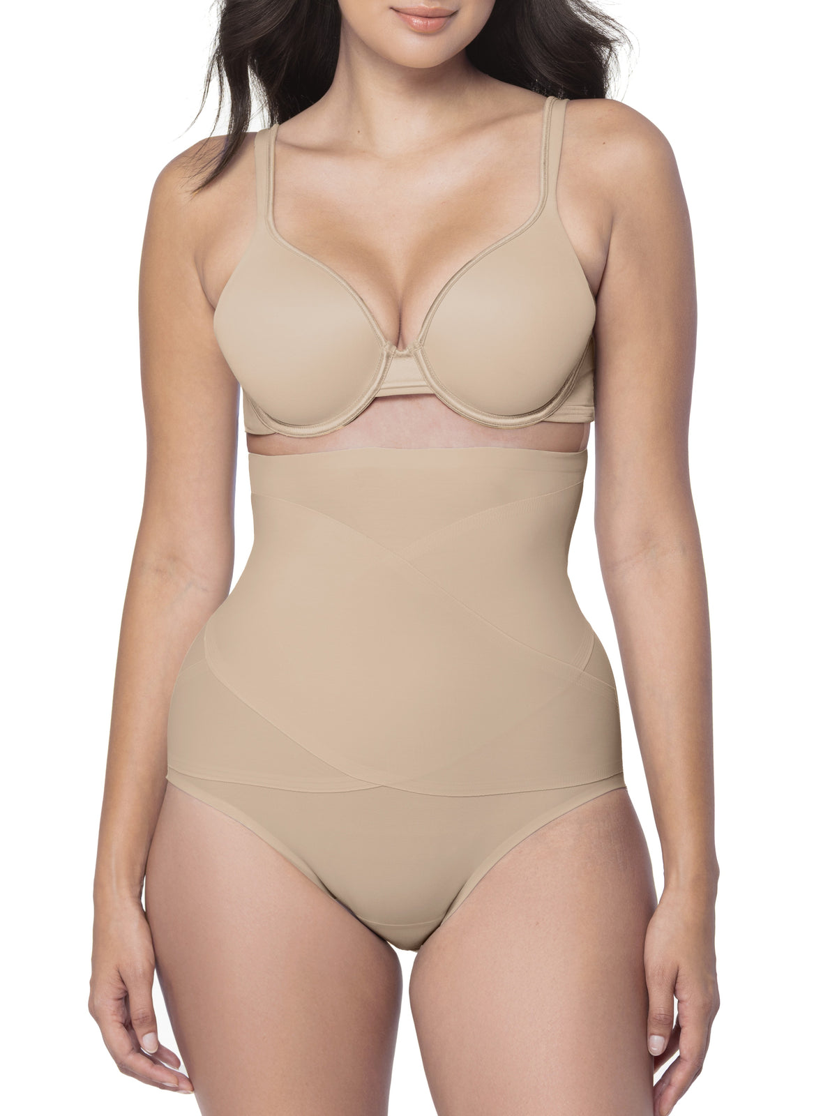 Woman wearing a beige shapewear brief on a white background