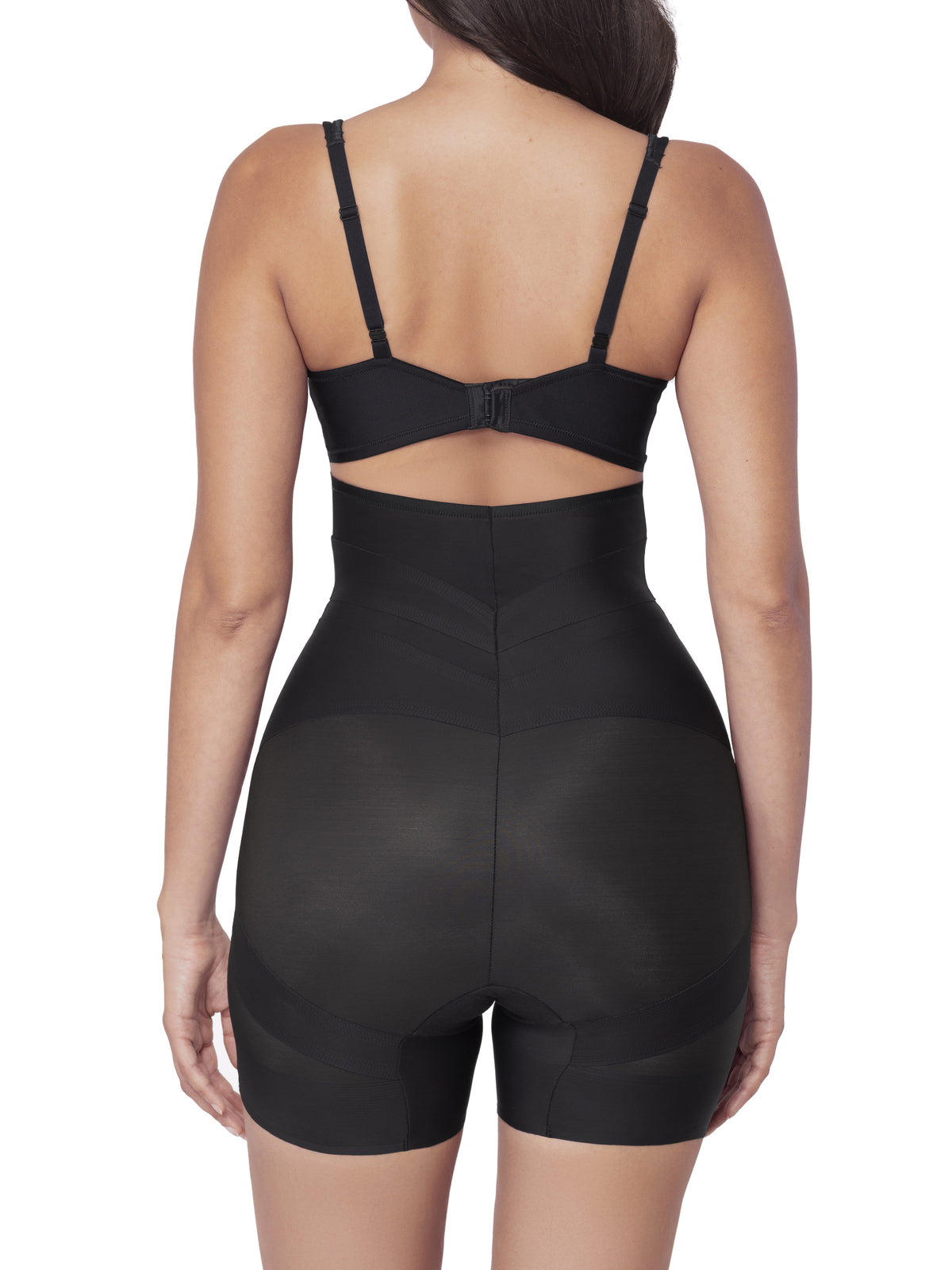 Black shapewear shorts worn by a model on a white background