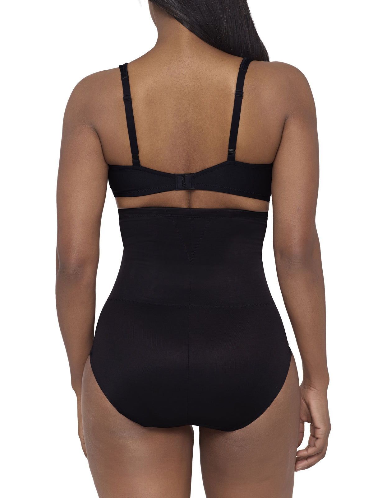 a woman wearing a black high waisted back smoothing tummy control brief miraclesuit