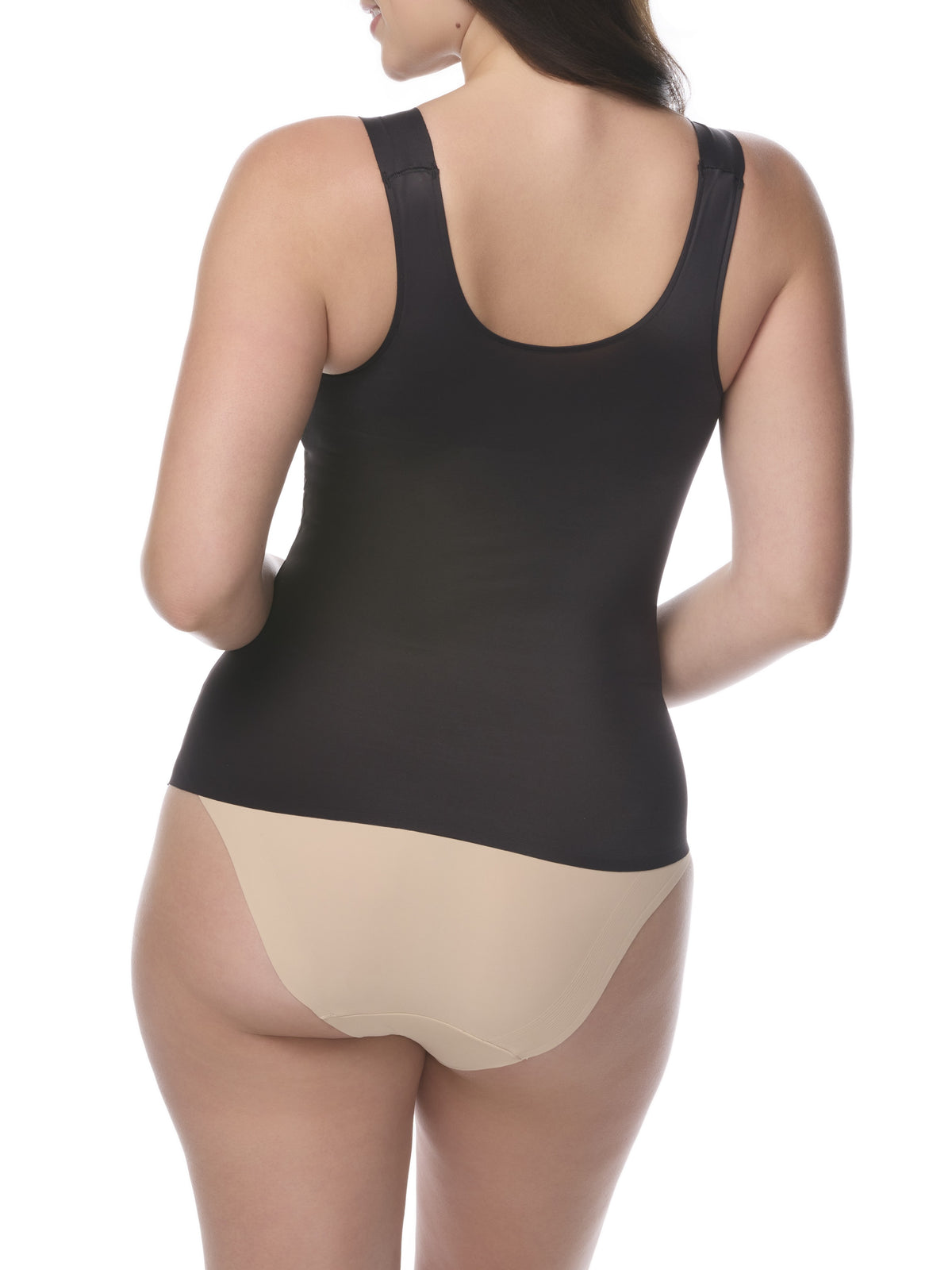Woman wearing a black shaping camisole and white underwear on a white background