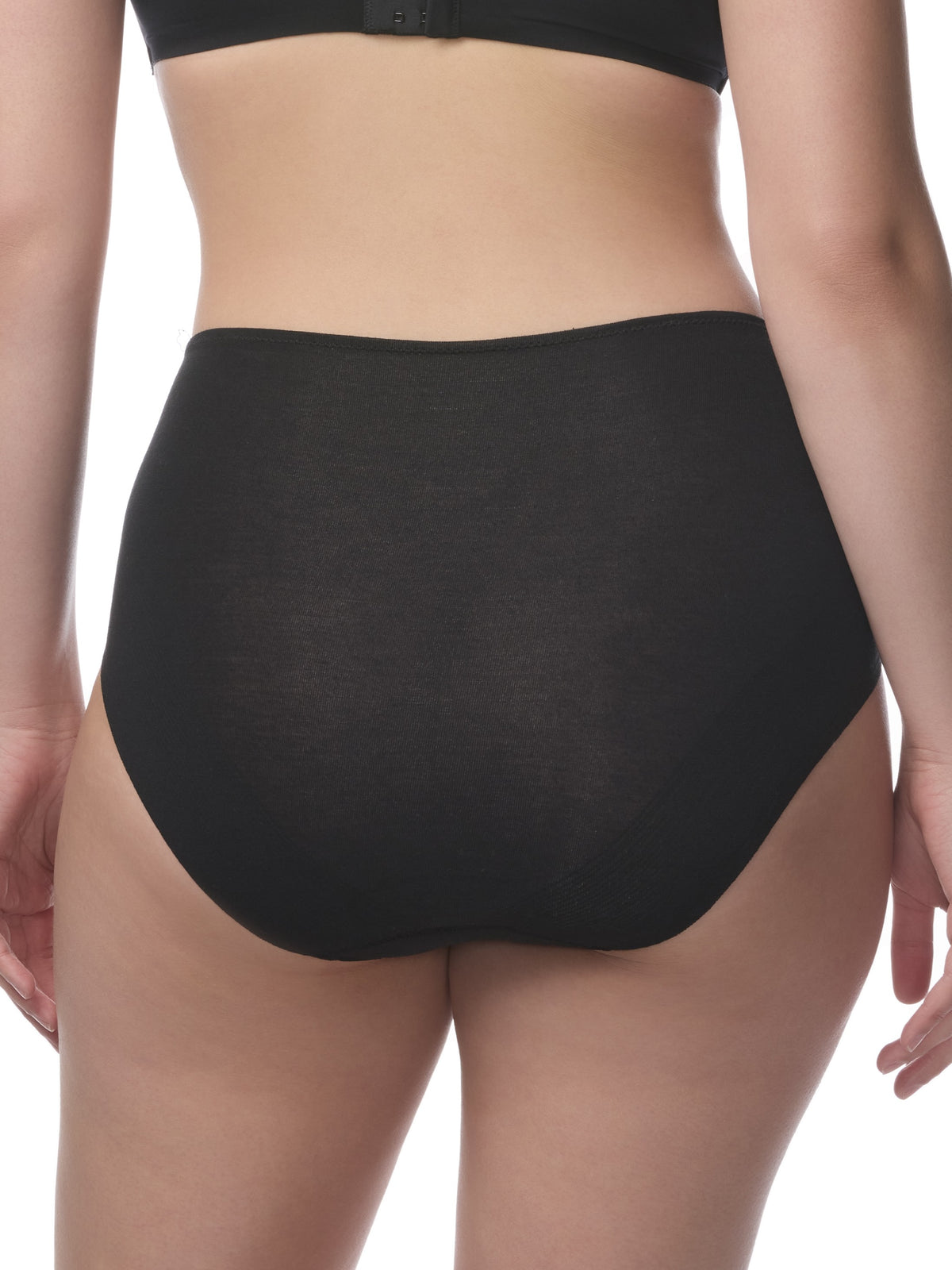 Black underwear being worn by a person on a white background