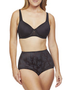 a woman wearing black tummy control underwear shapewear