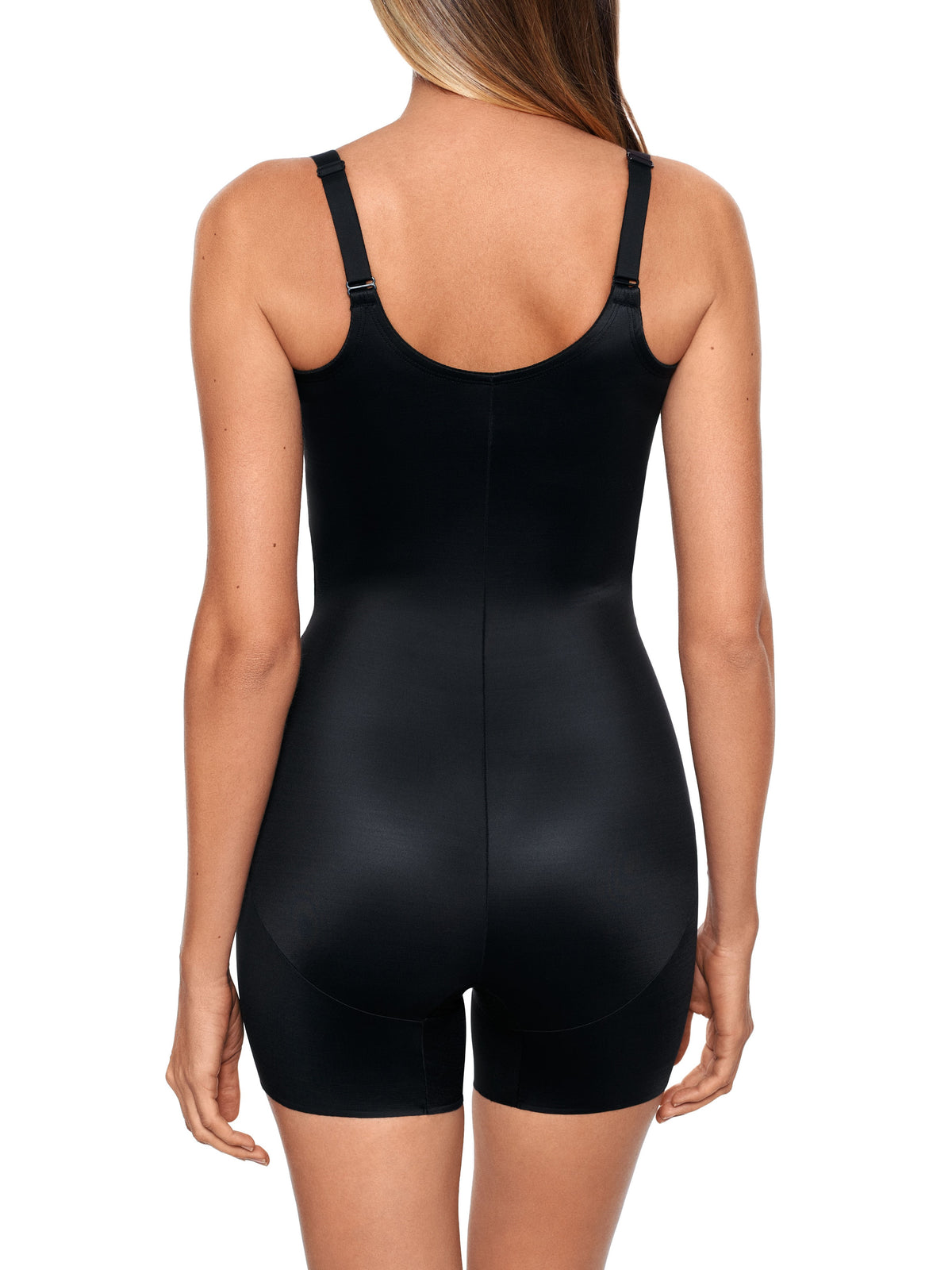 a woman wearing a black open bust tummy control shaping bodysuit shapewear
