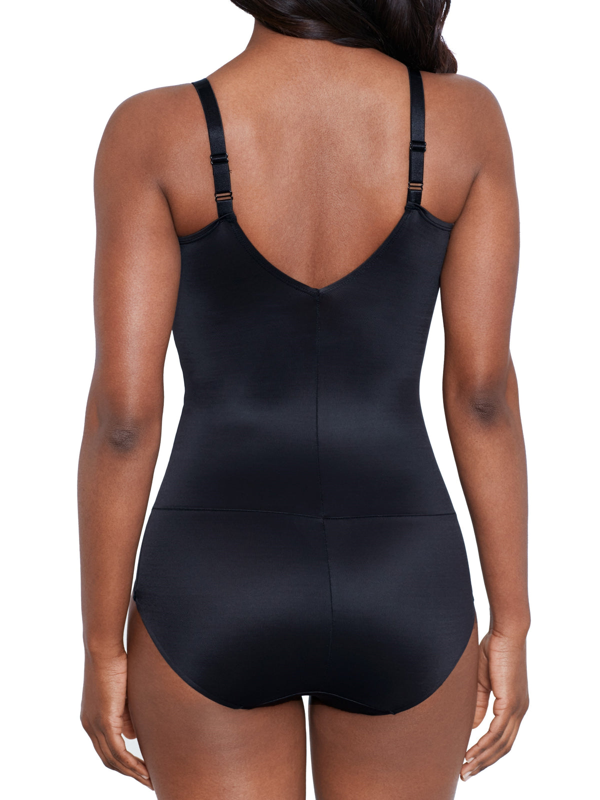 a woman wearing a black shaping bodysuit shapewear