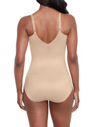 a woman wearing a nude shaping bodysuit shapewear