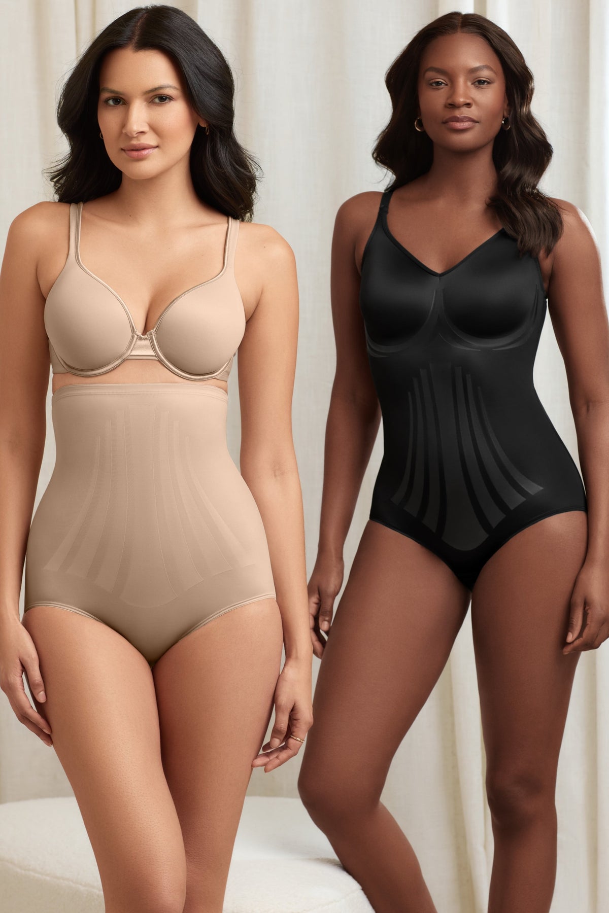 two women standing next to each other wearing a nude high waisted tummy control panty and a black body shaper shapewear
