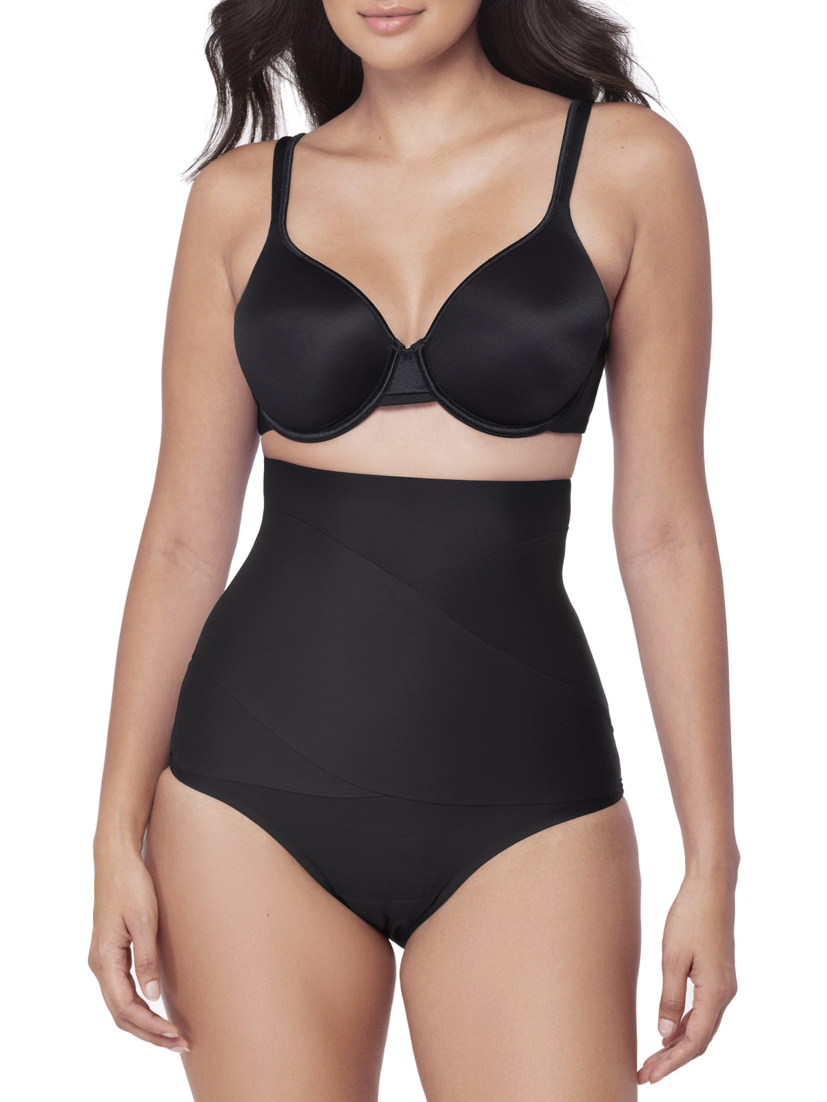 Woman wearing a black shapewear brief on a white background