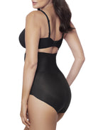 Woman wearing a black shapewear brief on a white background