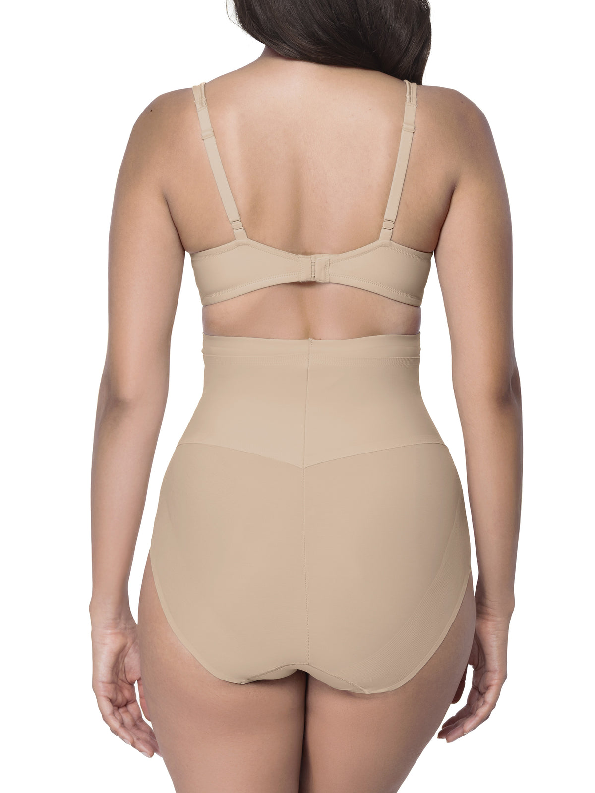 Woman wearing a beige shapewear brief on a white background