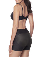 Black shapewear short on a model against a white background