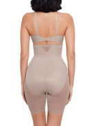 a woman wearing a nude high waisted sheer shapewear short body shaper