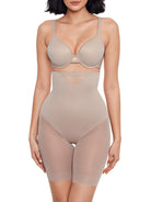 a woman wearing a nude high waisted sheer shapewear short body shaper