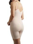 a woman wearing a nude tummy control body shaper bodysuit