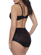 a woman wearing black tummy control underwear shapewear