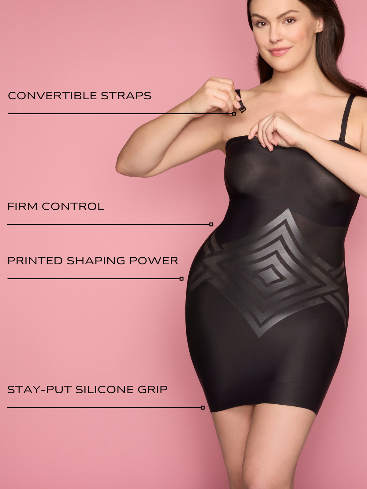 a woman wearing a black tummy control strapless slip body shaper shapewear and attaching her straps all-groups