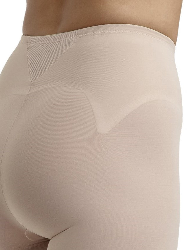 a close-up detail of a woman wearing nude tummy control leggings shapewear