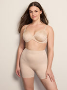 a woman wearing a nude tummy control shapewear short