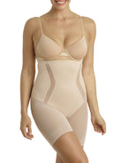 a woman wearing a nude high waisted tummy control shapewear short
