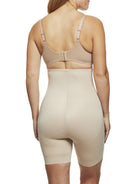 a woman wearing nude tummy control shapewear shorts