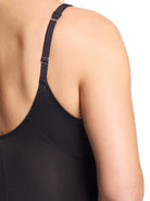 a close-up detail of a woman wearing a black plunge slip body shaper
