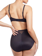 a woman wearing black tummy control underwear shapewear
