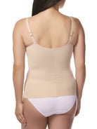 a woman wearing a beige underwire bra shaping camisole