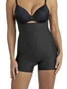 a woman wearing black high waisted tummy control shapewear shorts
