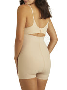 a woman wearing nude high waisted tummy control shapewear shorts