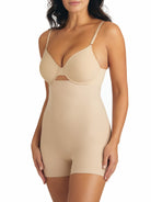 a woman wearing nude high waisted tummy control shapewear shorts