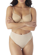 a woman wearing nude tummy control thong underwear