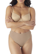 a woman wearing nude tummy control thong underwear