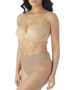 a woman wearing tan tummy control thong underwear