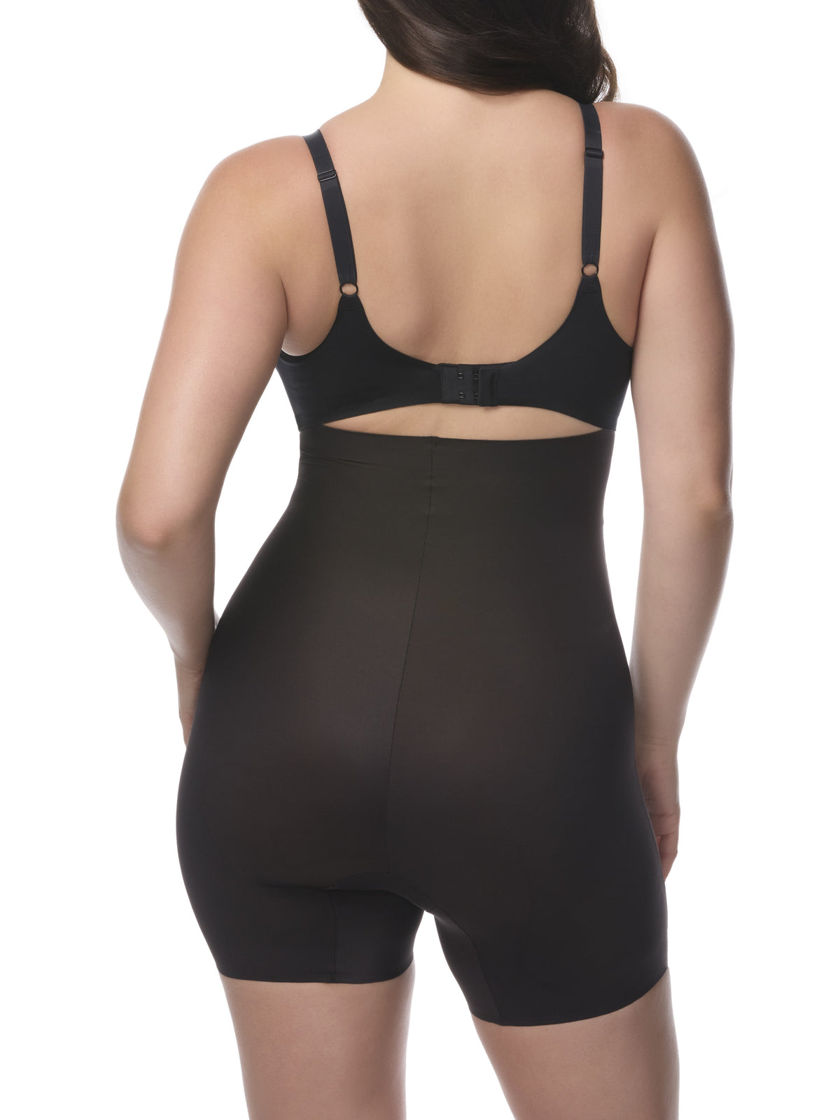 Black shapewear shorts worn by a model on a white background