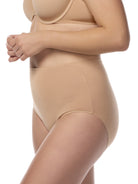 a woman wearing tan cotton blend women's brief panty