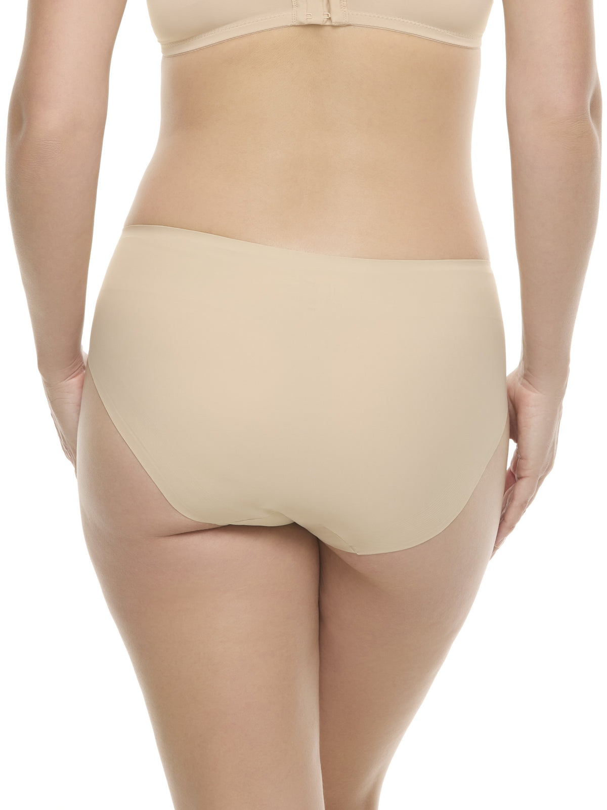 a woman wearing a beige high-cut brief panty underwear