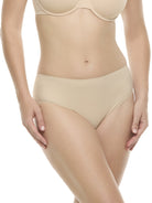 a woman wearing a beige high-cut brief panty underwear