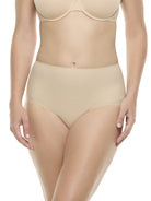 a woman wearing beige brief panty underwear