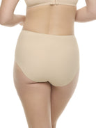 a woman wearing beige brief panty underwear