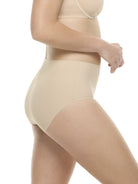 a woman wearing beige brief panty underwear