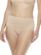 a woman wearing a beige color brief panty underwear